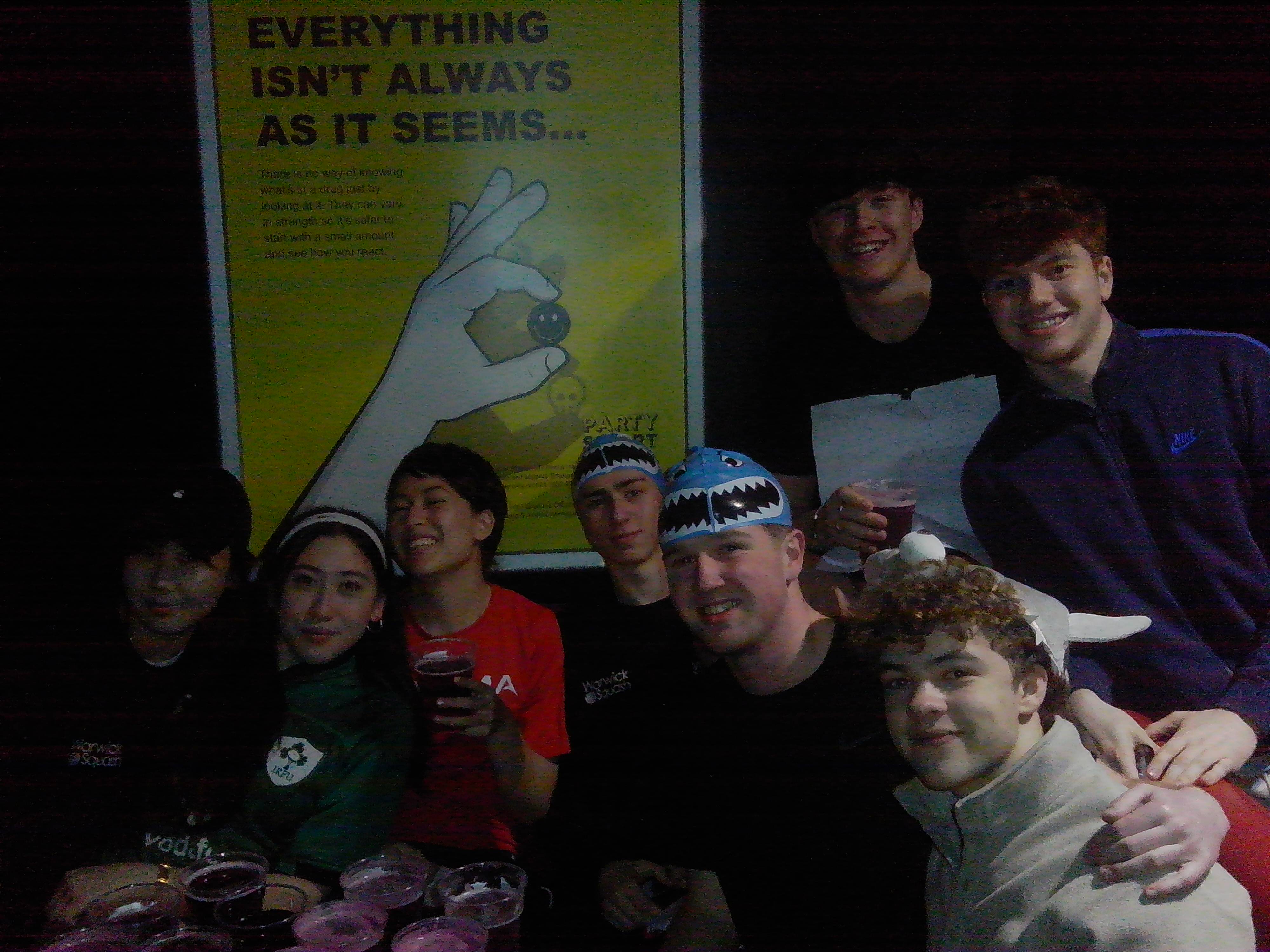 The club piled together for a group photo on a night out
