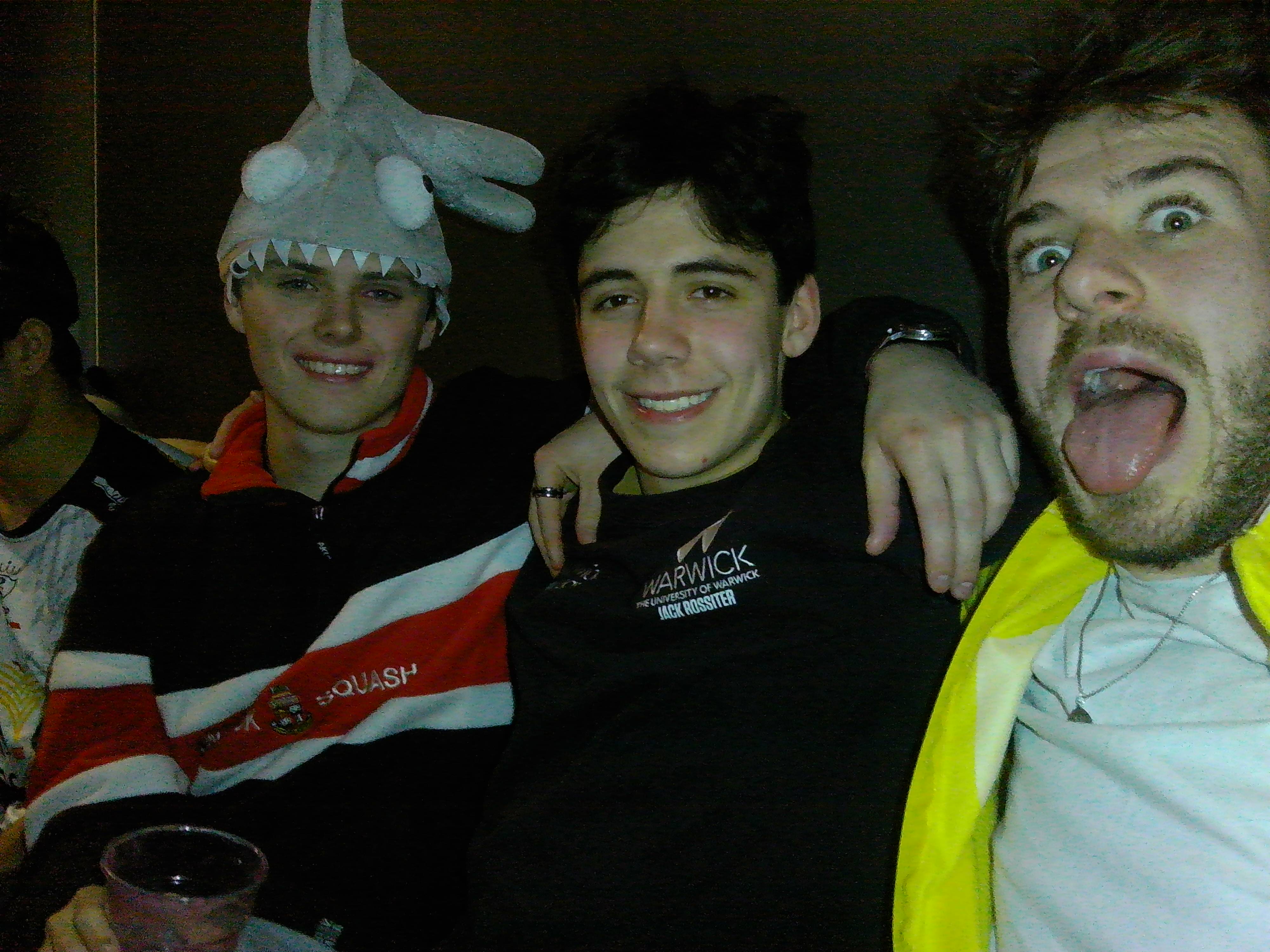 Members in fancy dress with arms round each other